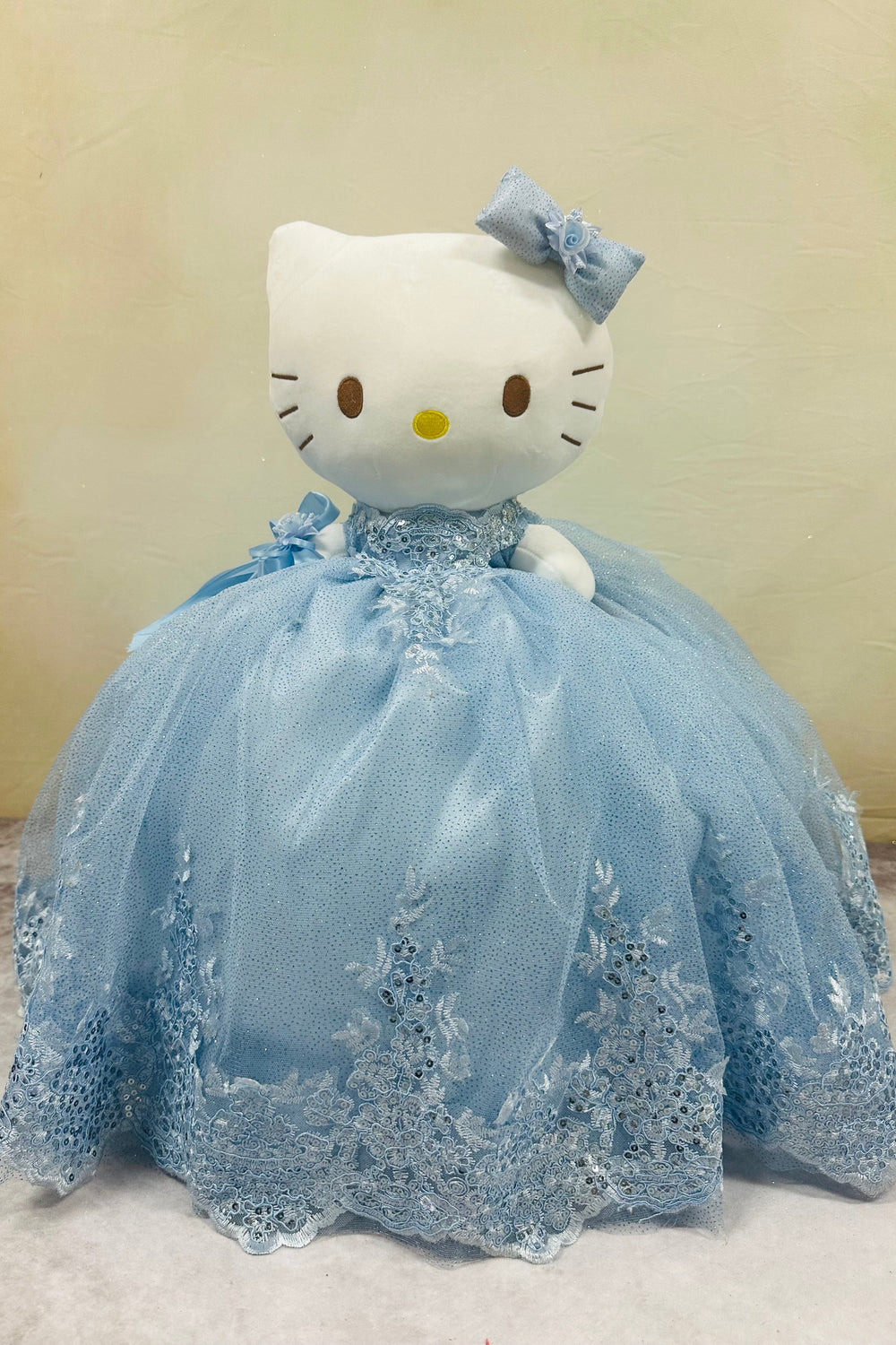 Beautiful Hello Kitty plush doll for quinceañera party, accessible for visually impaired.