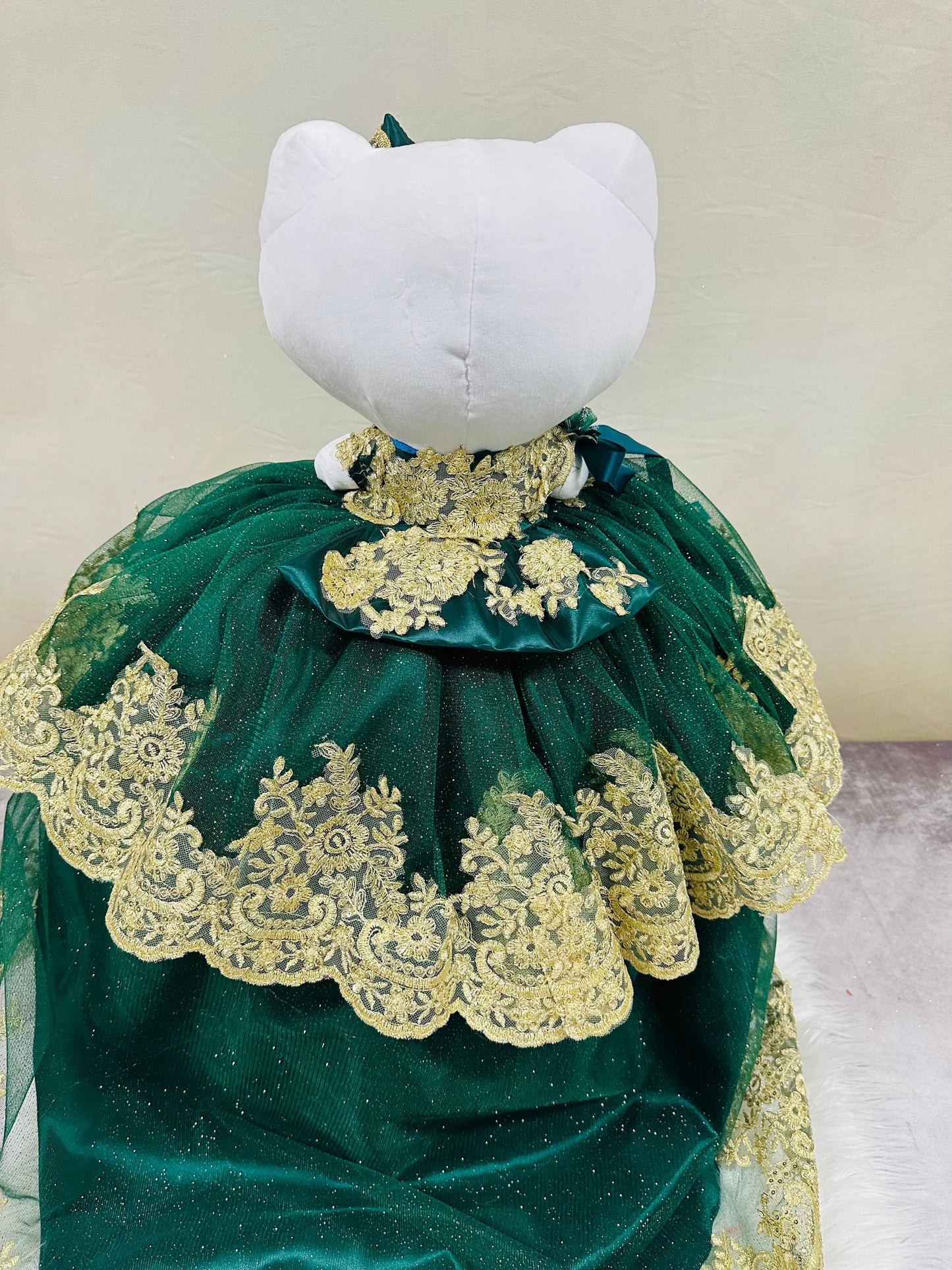 Lovely Hello Kitty plush doll for quinceañera party, accessible for visually impaired.
