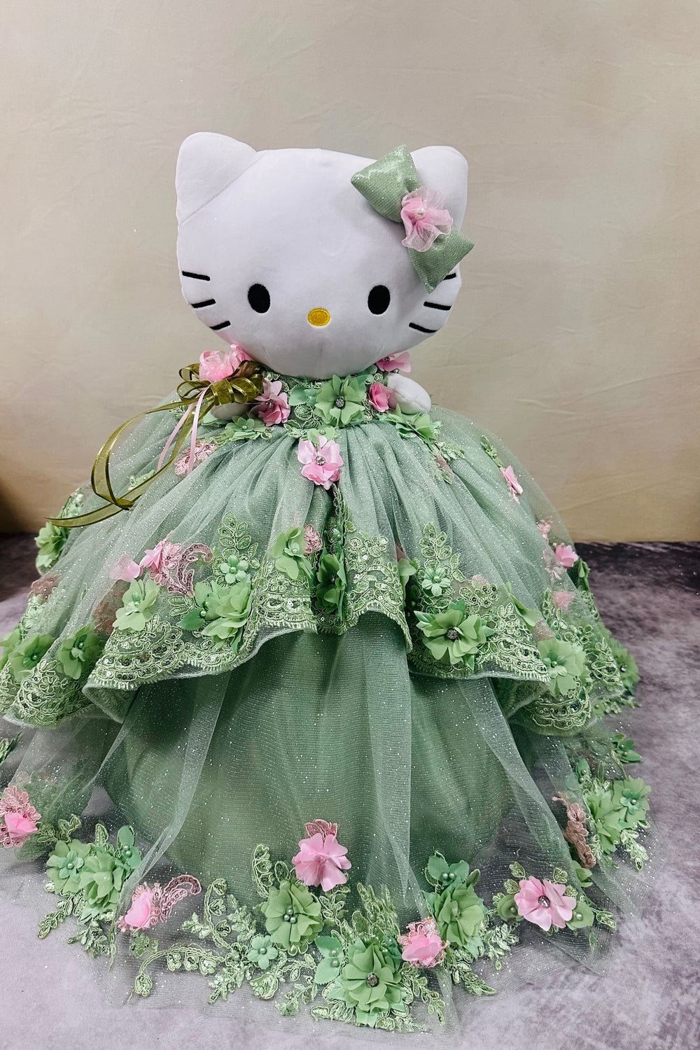 Hello Kitty plush doll for quinceañera party, accessible description for visually impaired.