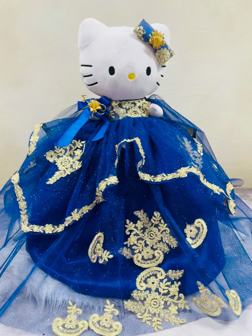 Charming Hello Kitty plush doll for quinceañera party, accessible for visually impaired.
