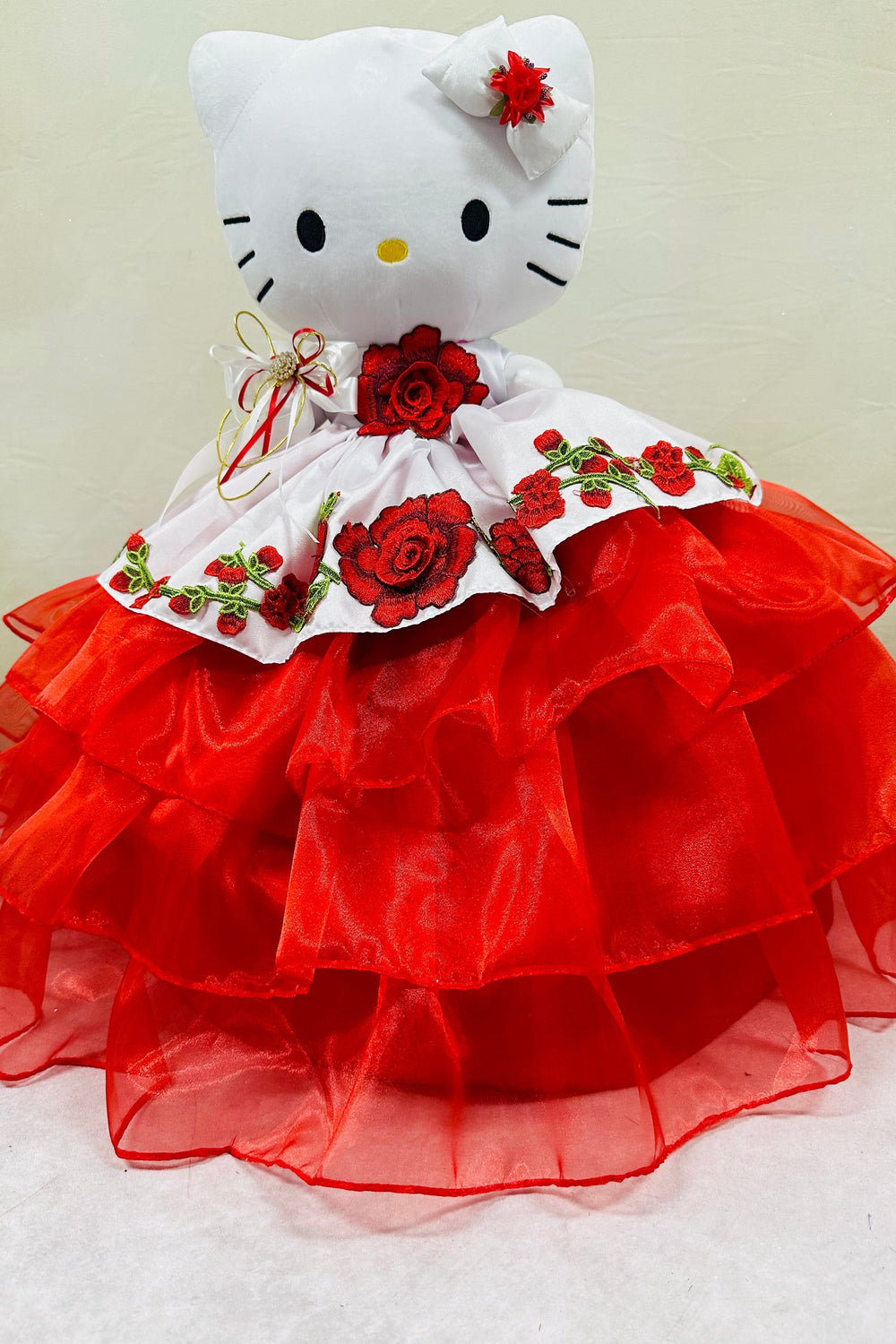 Charming Hello Kitty plush doll for quinceañera party, accessible for visually impaired.