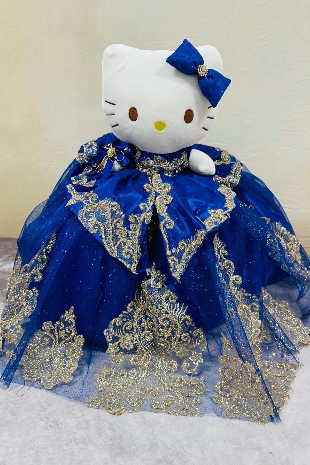 Adorable Hello Kitty plush doll for quinceañera party.ROYAL AND GOLD 