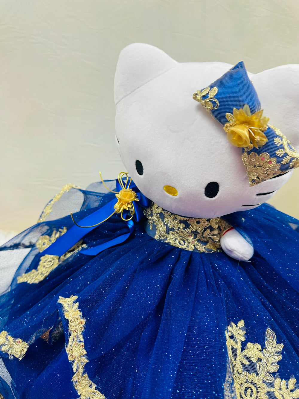 Charming Hello Kitty plush doll for quinceañera party, accessible for visually impaired.