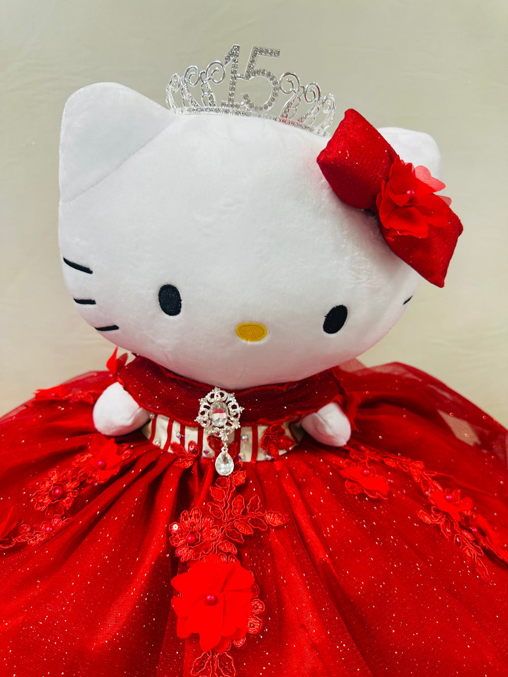 red Hello Kitty plush doll for quinceañera party, accessible for visually impaired.