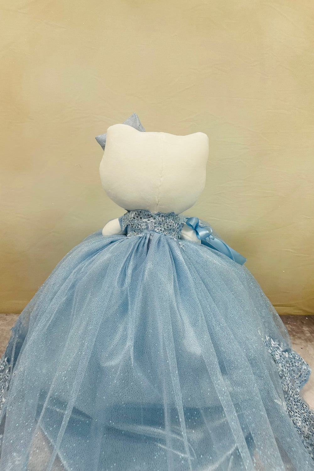 Beautiful Hello Kitty plush doll for quinceañera party, accessible for visually impaired.