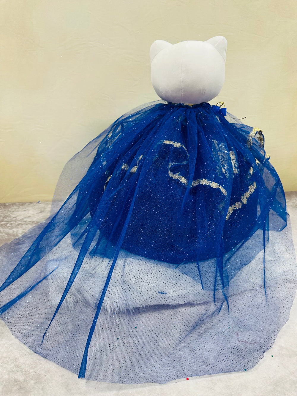 Charming Hello Kitty plush doll for quinceañera party, accessible for visually impaired.