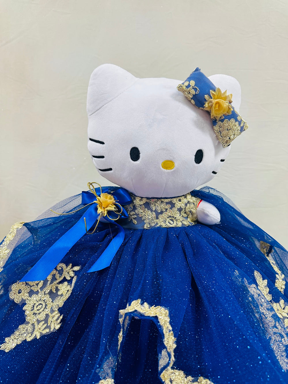 Charming Hello Kitty plush doll for quinceañera party, accessible for visually impaired.
